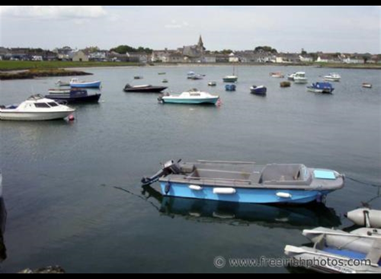 Ballywalter Harbour showing church spire