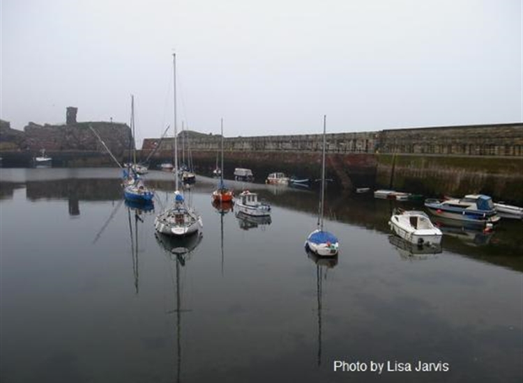 Yacht moorings - note that these dry (fin keelers already lying on their sides)