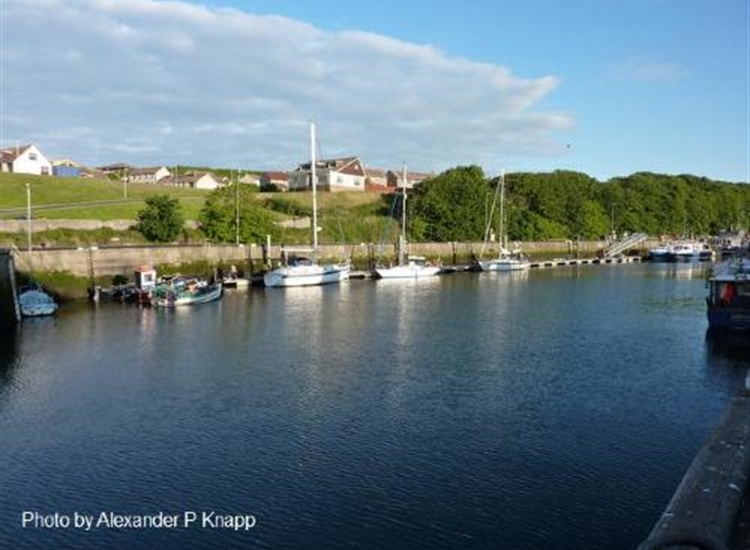 Eyemouth harbour serviced pontoon against the middle quay
