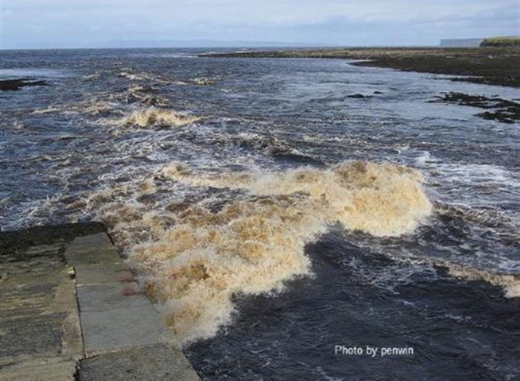 Thurso entrance at Low Water with the river in spate. 'Ere be dragons
